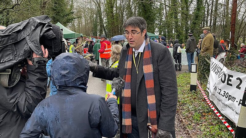 Paul Follows talking to reporters in Dunsfold near the site of proposed fossil-fuel drilling